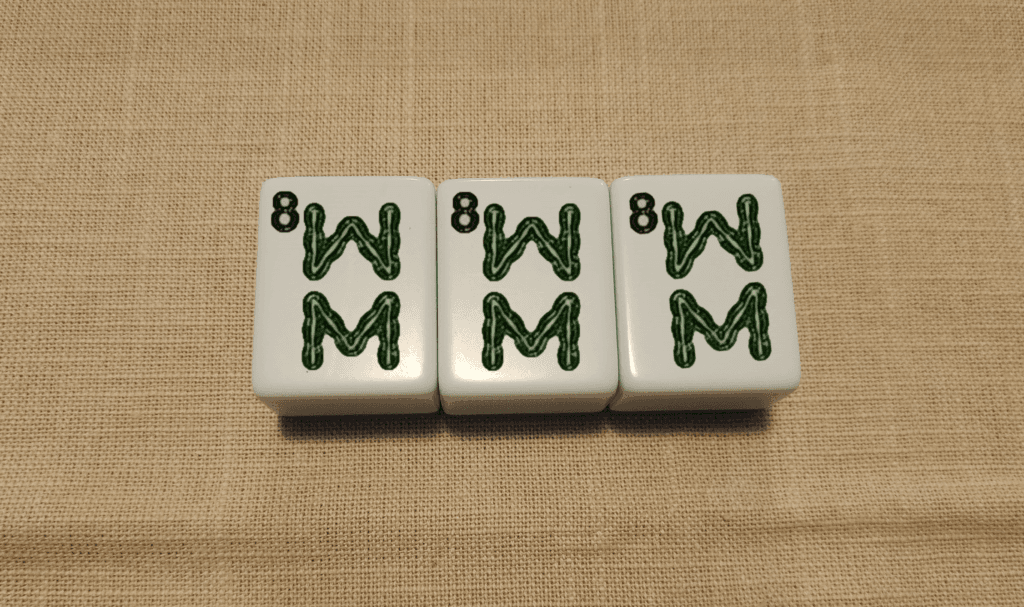 Mahjong pong: three identical tiles forming a set