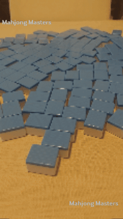 Animation of a player shuffling mahjong tiles face down on the table