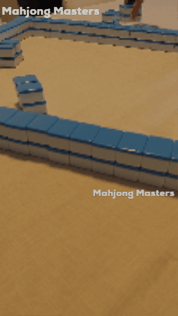Animation of players building the mahjong wall before play begins